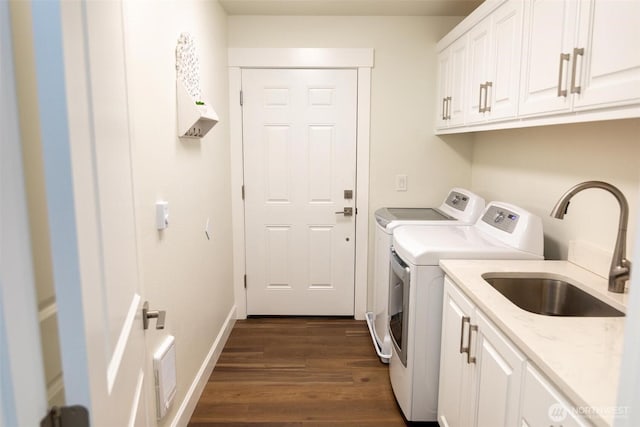 29813 L Ln, Ocean Park, WA 98640 - washroom with washing machine and clothes dryer, cabinet space, and dark wood finished floors