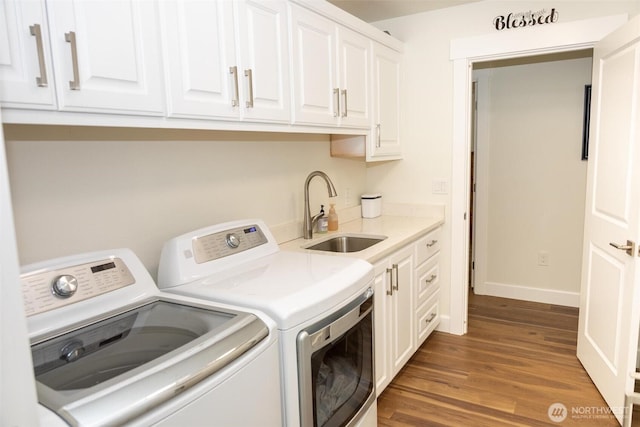 29813 L Ln, Ocean Park, WA 98640 - washroom featuring washer and dryer, cabinet space, and wood finished floors