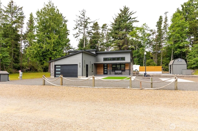 29813 L Ln, Ocean Park, WA 98640 - contemporary house featuring a storage shed, view of scattered trees, and an attached garage