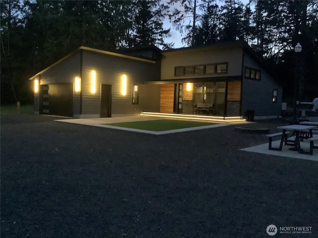 29813 L Ln, Ocean Park, WA 98640 - back of property at dusk featuring a patio