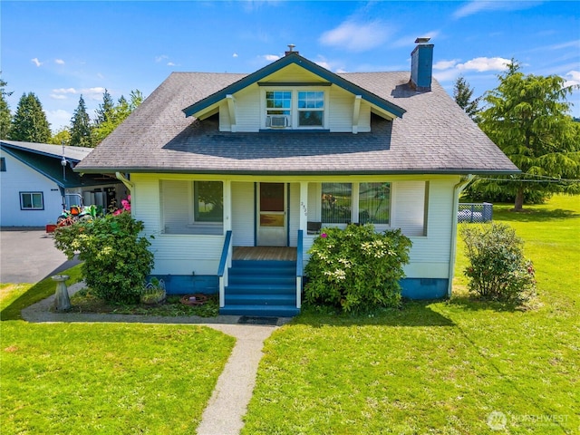 2520 Eureka Ave, Centralia, WA 98531 - view of front of property with a chimney, a front lawn, a porch, roof with shingles, and cooling unit