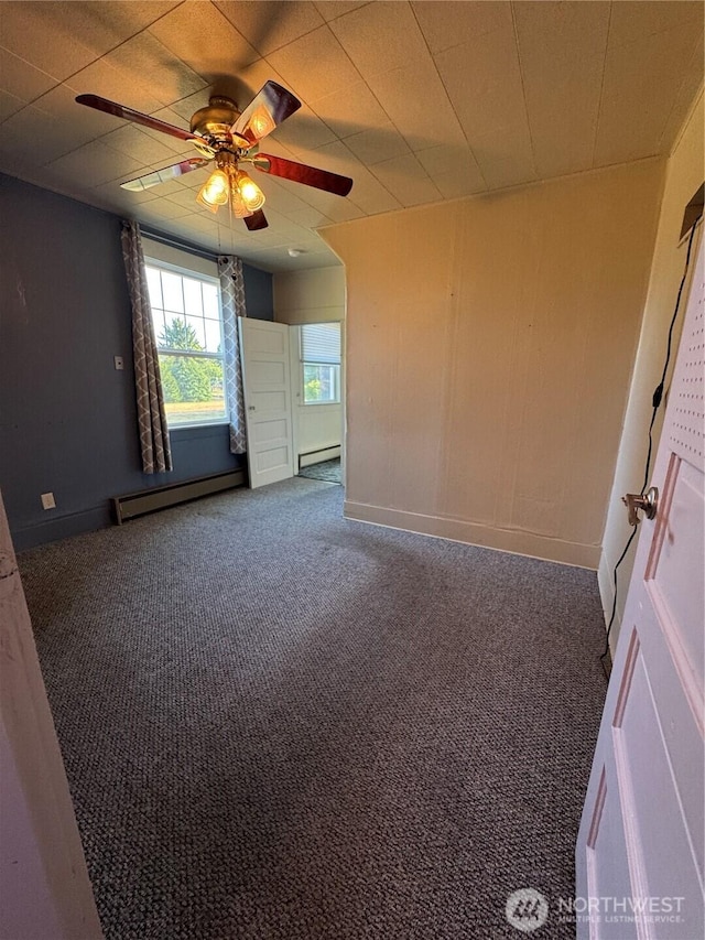 2520 Eureka Ave, Centralia, WA 98531 - carpeted spare room with a baseboard heating unit and ceiling fan