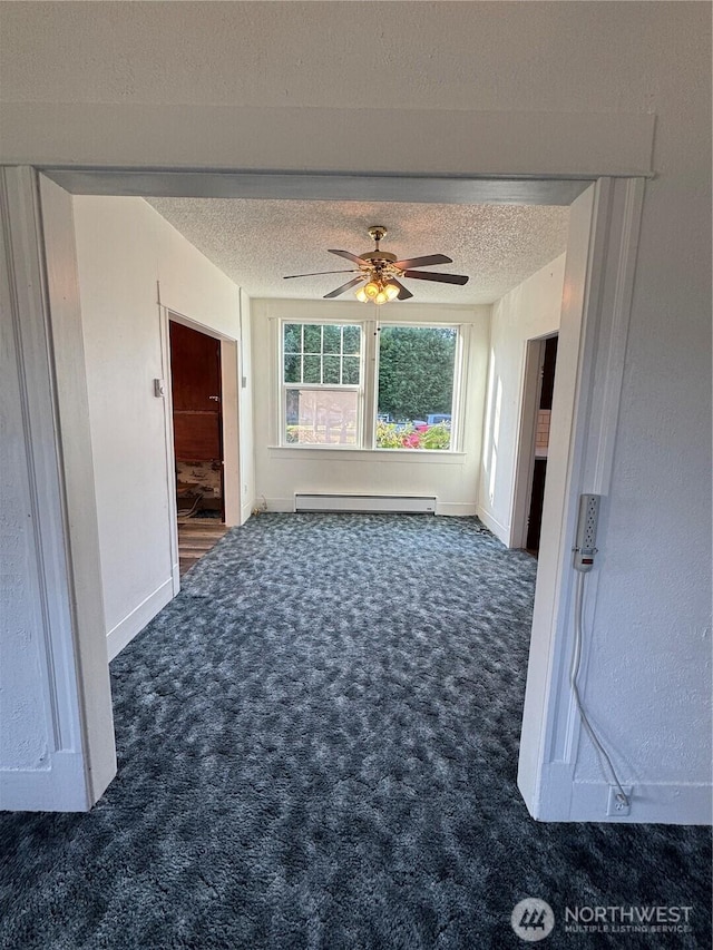 2520 Eureka Ave, Centralia, WA 98531 - carpeted spare room featuring a baseboard radiator, a textured ceiling, and ceiling fan
