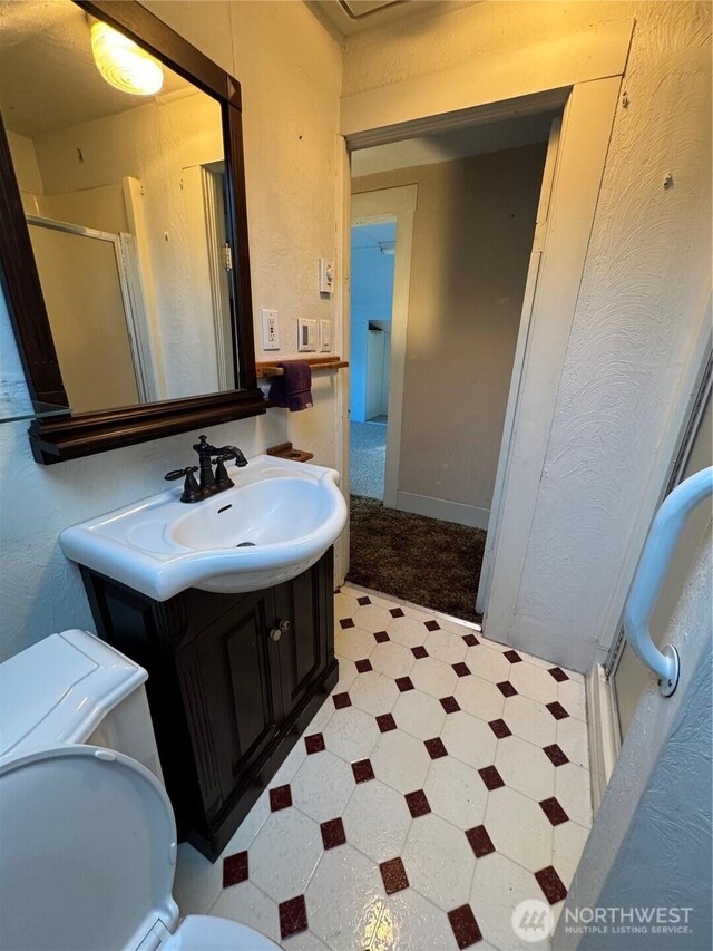 2520 Eureka Ave, Centralia, WA 98531 - bathroom featuring tile patterned floors, vanity, and a stall shower