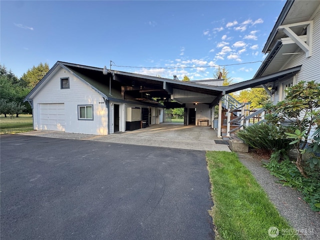 2520 Eureka Ave, Centralia, WA 98531 - view of front facade featuring asphalt driveway, stairs, and a garage