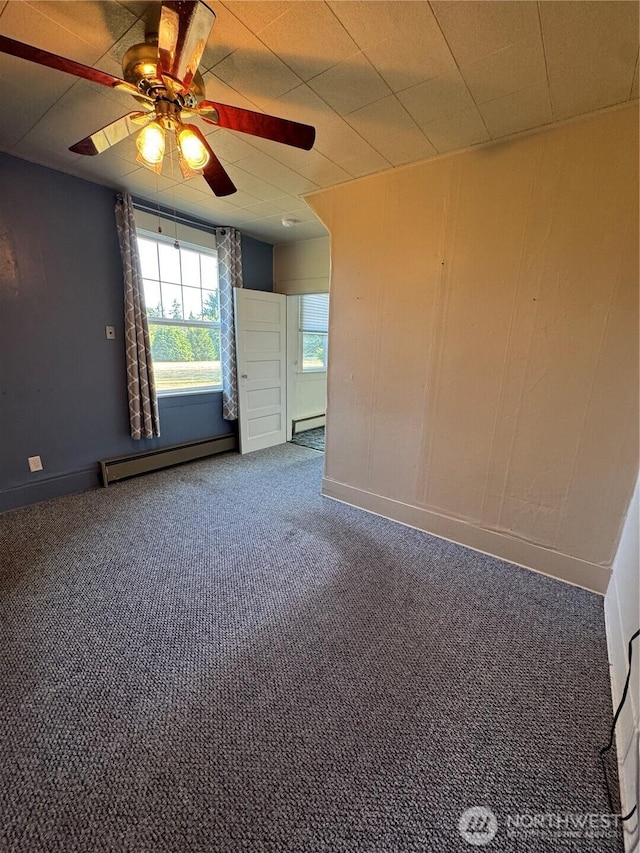 2520 Eureka Ave, Centralia, WA 98531 - carpeted spare room featuring a baseboard radiator, a ceiling fan, and baseboard heating