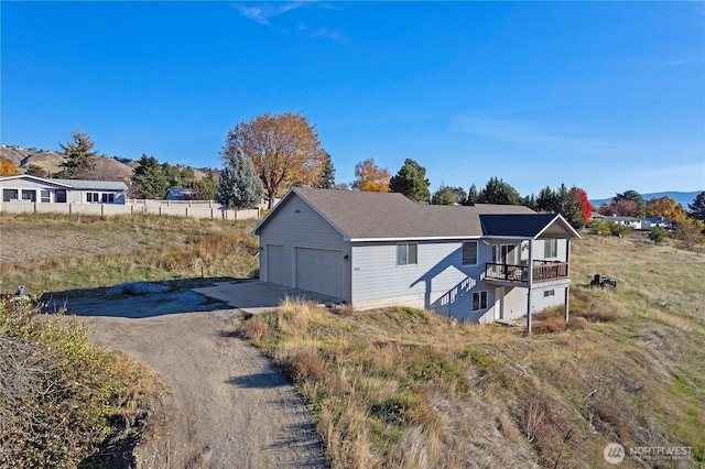 2599 NW Columbia Ave, East Wenatchee, WA 98802 - view of property exterior featuring a deck, a garage, and driveway