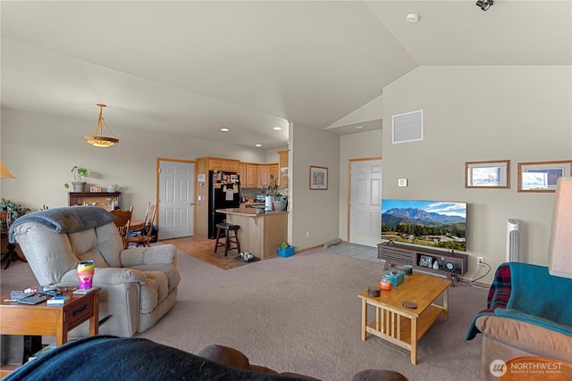 2599 NW Columbia Ave, East Wenatchee, WA 98802 - living room featuring light colored carpet, recessed lighting, and lofted ceiling