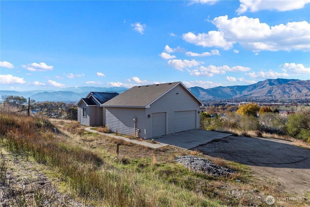 2599 NW Columbia Ave, East Wenatchee, WA 98802 - view of property exterior featuring a mountain view and a garage