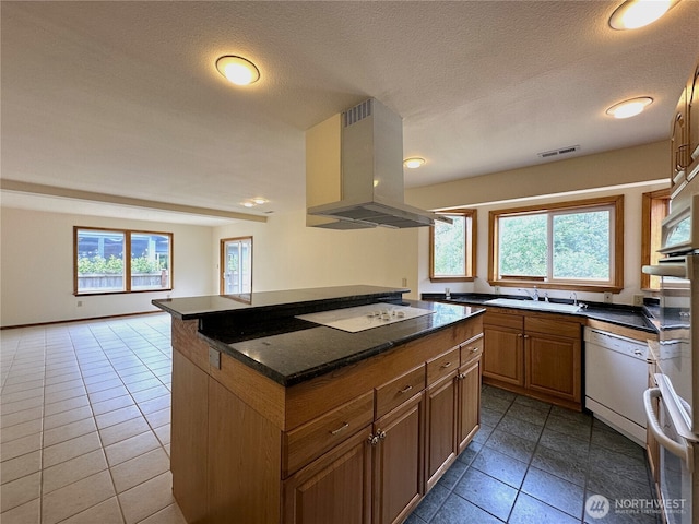 832 Whale Ct SW, Ocean Shores, WA 98569 - kitchen with island range hood, white appliances, plenty of natural light, a center island, and recessed lighting