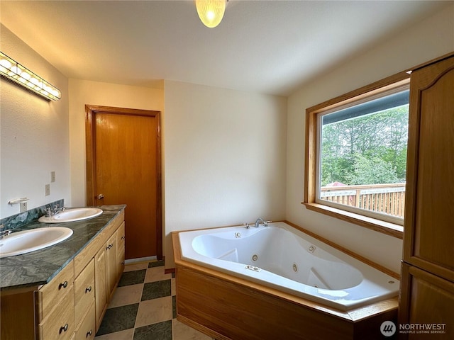 832 Whale Ct SW, Ocean Shores, WA 98569 - full bath featuring a jetted tub, double vanity, and tile patterned floors