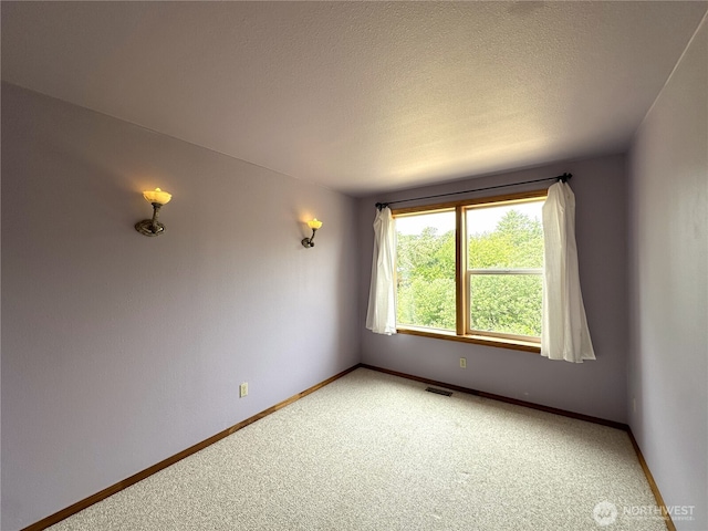832 Whale Ct SW, Ocean Shores, WA 98569 - unfurnished room with light carpet and a textured ceiling