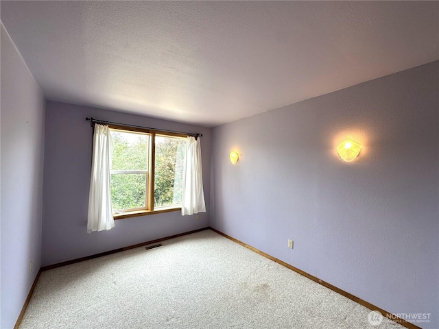 832 Whale Ct SW, Ocean Shores, WA 98569 - spare room with light colored carpet and baseboards