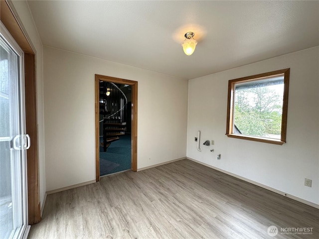 832 Whale Ct SW, Ocean Shores, WA 98569 - spare room featuring light wood-style floors and stairs