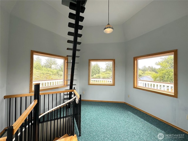 832 Whale Ct SW, Ocean Shores, WA 98569 - carpeted spare room featuring baseboards and a towering ceiling