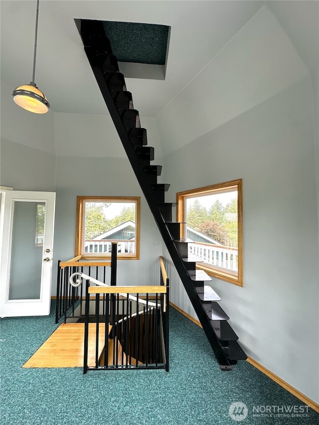 832 Whale Ct SW, Ocean Shores, WA 98569 - stairway featuring carpet flooring and a high ceiling