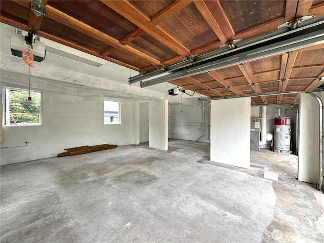 832 Whale Ct SW, Ocean Shores, WA 98569 - garage with water heater and a garage door opener