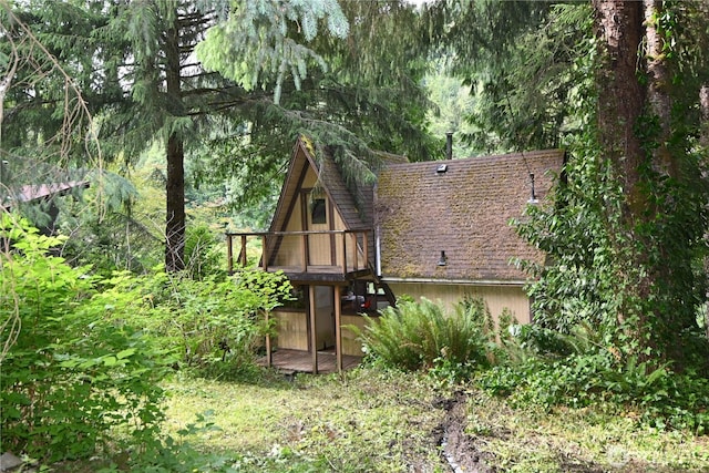 53009 S Riverside Rd, Gold Bar, WA 98251 - rear view of property featuring a deck and a shingled roof