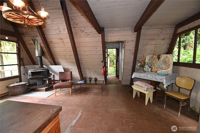 53009 S Riverside Rd, Gold Bar, WA 98251 - sunroom / solarium with a wood stove, a chandelier, and beamed ceiling