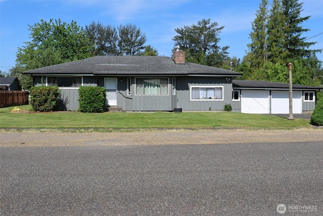 251 N 2nd St N, Buckley, WA 98321 - view of front of property with a chimney, an attached garage, and a shingled roof