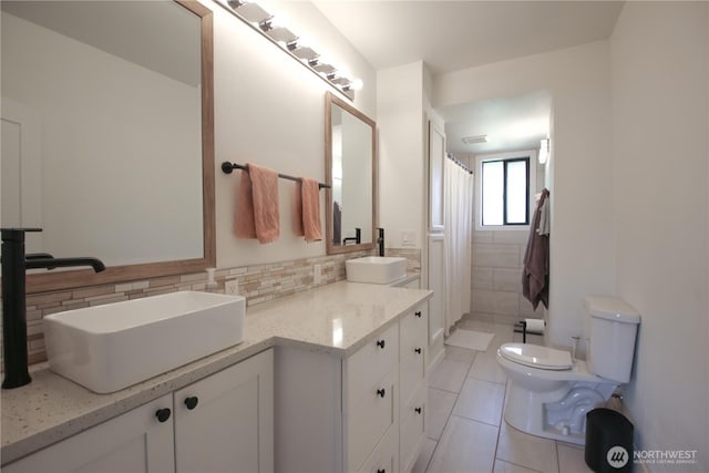 251 N 2nd St N, Buckley, WA 98321 - bathroom with vanity, tile patterned flooring, curtained shower, and decorative backsplash