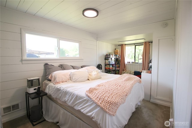 251 N 2nd St N, Buckley, WA 98321 - carpeted bedroom with wood walls and wooden ceiling