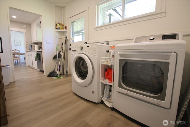 251 N 2nd St N, Buckley, WA 98321 - washroom featuring washing machine and dryer and light wood-style floors