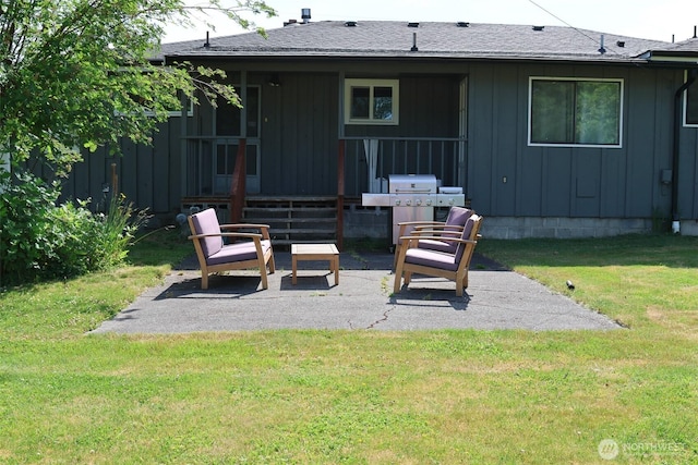 251 N 2nd St N, Buckley, WA 98321 - back of property featuring board and batten siding, a patio area, and a yard