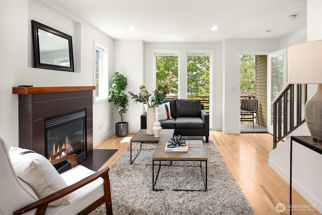 4220 Fremont Ave N Unit A, Seattle, WA 98103 - living area with light wood finished floors, a tile fireplace, and recessed lighting