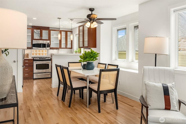 4220 Fremont Ave N Unit A, Seattle, WA 98103 - dining area with light wood-style flooring, a ceiling fan, and recessed lighting