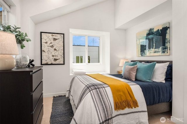 4220 Fremont Ave N Unit A, Seattle, WA 98103 - carpeted bedroom featuring baseboards and lofted ceiling