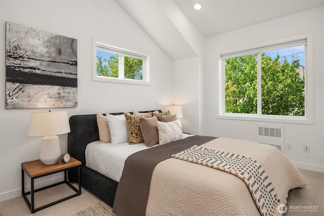 4220 Fremont Ave N Unit A, Seattle, WA 98103 - bedroom featuring radiator heating unit, vaulted ceiling, and carpet
