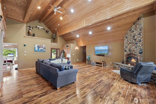 33320 27th Ave E, Roy, WA 98580 - living room with wood-type flooring, a ceiling fan, high vaulted ceiling, recessed lighting, and a stone fireplace