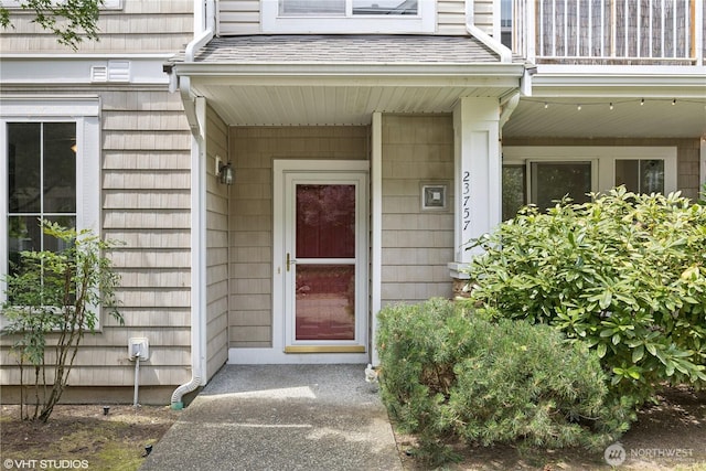 23757 SE 52nd Ln Unit 13-1, Issaquah, WA 98029 - property entrance featuring a balcony and a shingled roof