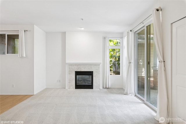 23757 SE 52nd Ln Unit 13-1, Issaquah, WA 98029 - unfurnished living room featuring a premium fireplace and carpet floors
