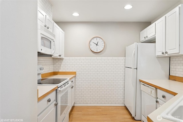 23757 SE 52nd Ln Unit 13-1, Issaquah, WA 98029 - kitchen featuring white appliances, white cabinetry, light countertops, recessed lighting, and light wood-type flooring