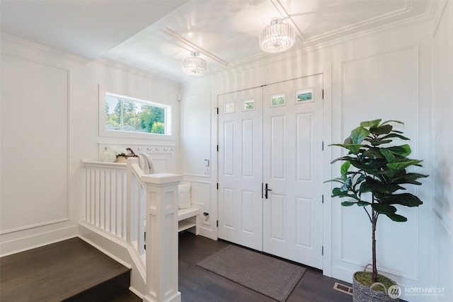 1818 36th St, Bellingham, WA 98226 - entrance foyer with dark wood finished floors, crown molding, and a chandelier