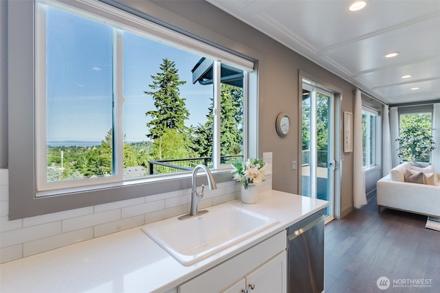 1818 36th St, Bellingham, WA 98226 - kitchen with dishwasher, white cabinets, wood finished floors, light countertops, and recessed lighting