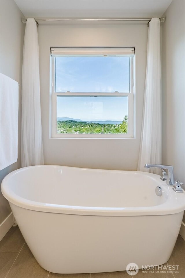 1818 36th St, Bellingham, WA 98226 - bathroom featuring a freestanding tub and tile patterned flooring