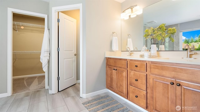 4597 Rutherford Cir SW, Port Orchard, WA 98367 - bathroom featuring double vanity and a spacious closet