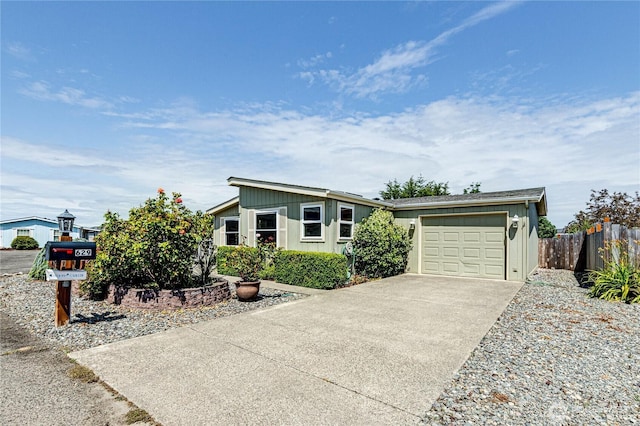 629 N 7th Ave, Sequim, WA 98382 - mid-century home featuring a garage and concrete driveway