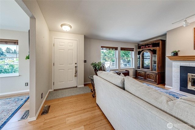 629 N 7th Ave, Sequim, WA 98382 - living room featuring light wood finished floors and a fireplace