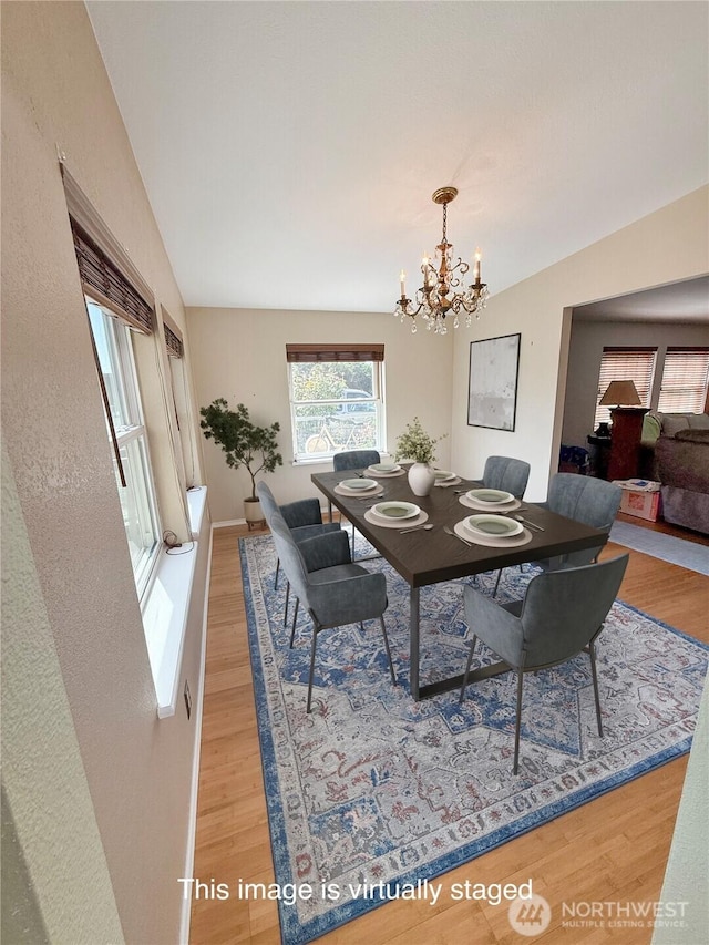 629 N 7th Ave, Sequim, WA 98382 - dining area featuring light wood-style flooring, a chandelier, and lofted ceiling