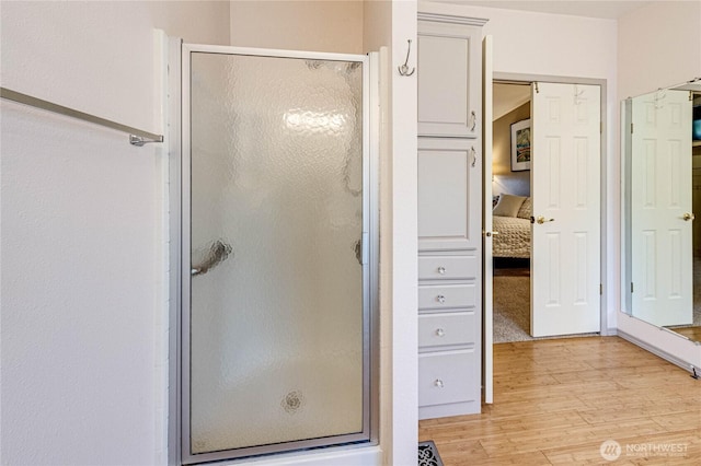 629 N 7th Ave, Sequim, WA 98382 - ensuite bathroom featuring wood finished floors and a shower stall