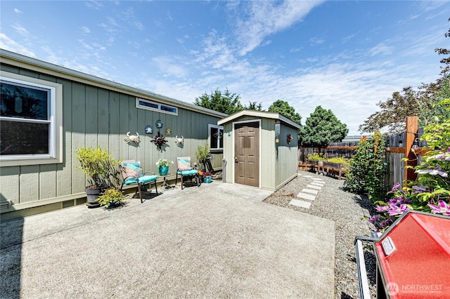 629 N 7th Ave, Sequim, WA 98382 - fenced backyard with a patio area and a storage unit