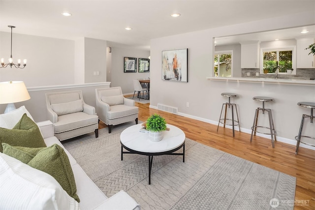 16011 Sunnyside Ave N, Shoreline, WA 98133 - living area with light wood-type flooring, a chandelier, and recessed lighting