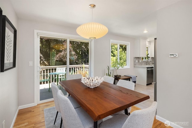 16011 Sunnyside Ave N, Shoreline, WA 98133 - dining space with baseboards and light wood finished floors