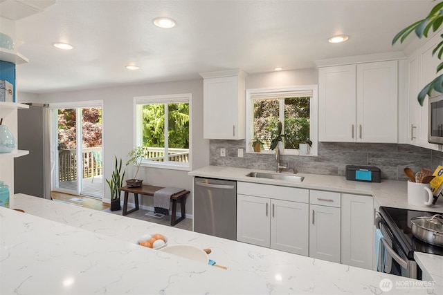 16011 Sunnyside Ave N, Shoreline, WA 98133 - kitchen with stainless steel appliances, backsplash, white cabinets, light stone counters, and recessed lighting