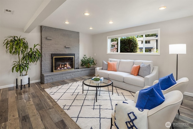 16011 Sunnyside Ave N, Shoreline, WA 98133 - living room featuring wood finished floors, recessed lighting, and a stone fireplace