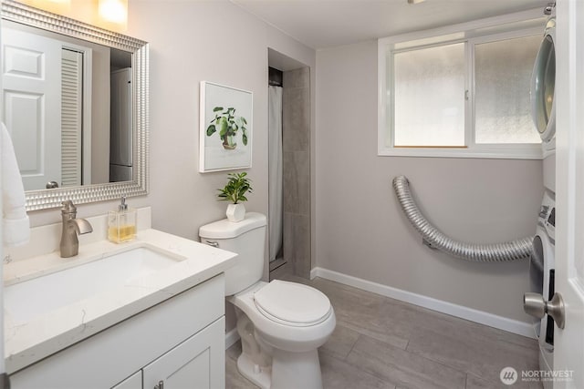 16011 Sunnyside Ave N, Shoreline, WA 98133 - full bathroom with stacked washing machine and dryer, vanity, curtained shower, and tile patterned floors